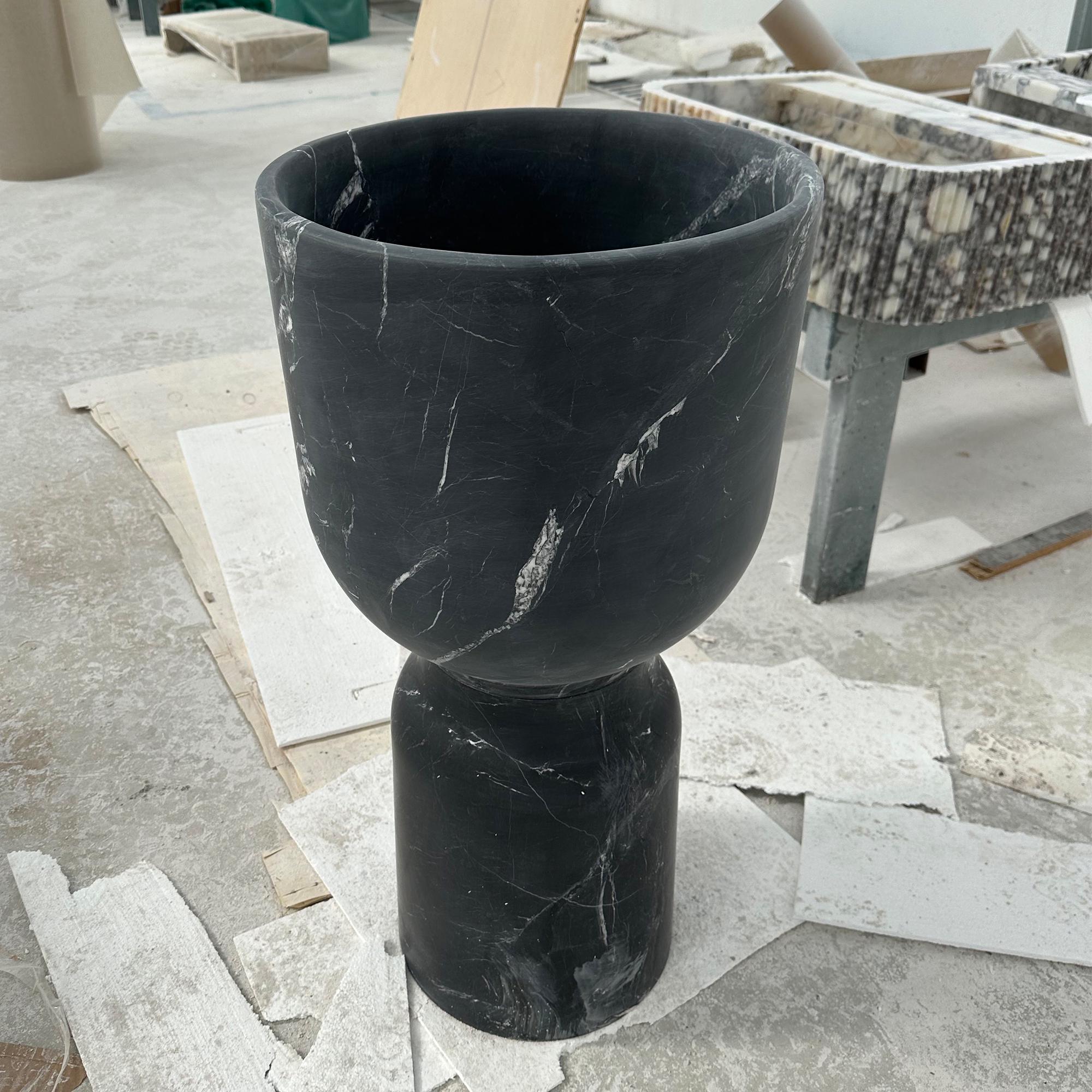 black marble pedestal sink