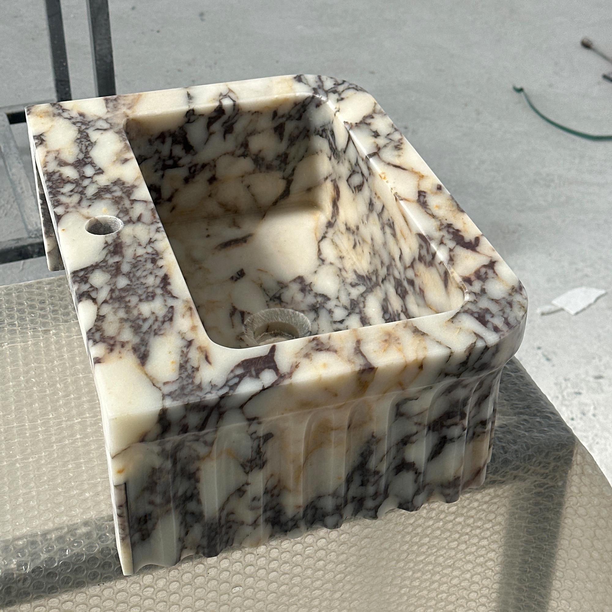 designer bathroom sink in calacatta viola marble