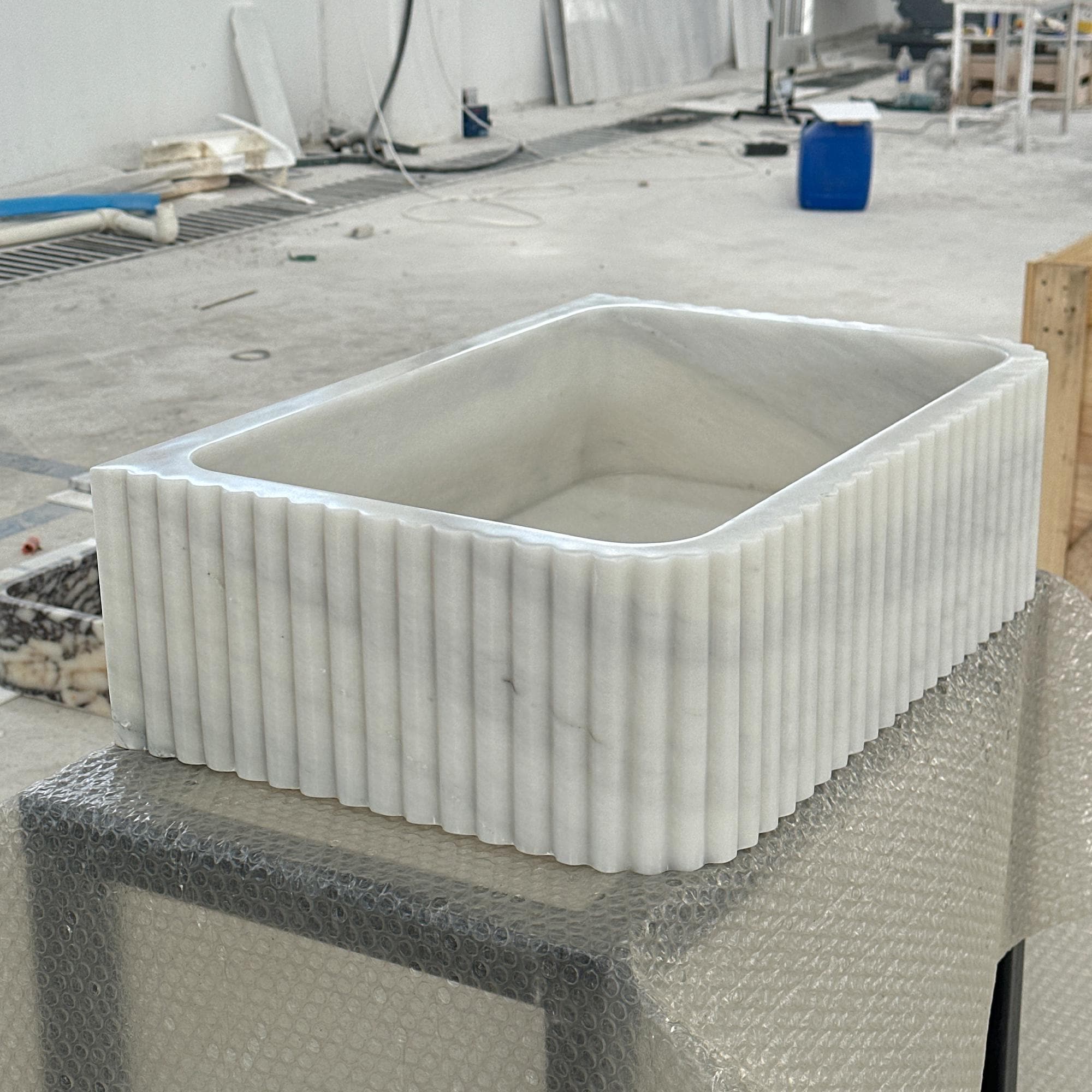 fluted carrara marble vessel sink design