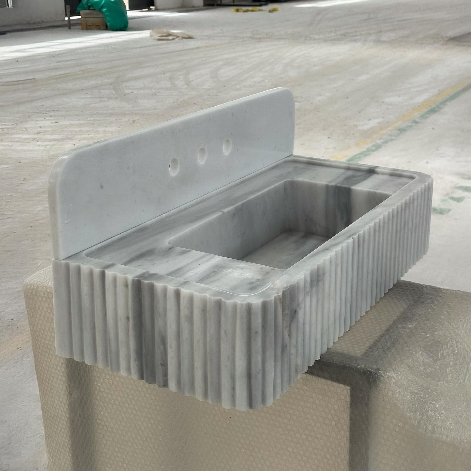 fluted carrara marble wall hung sink design