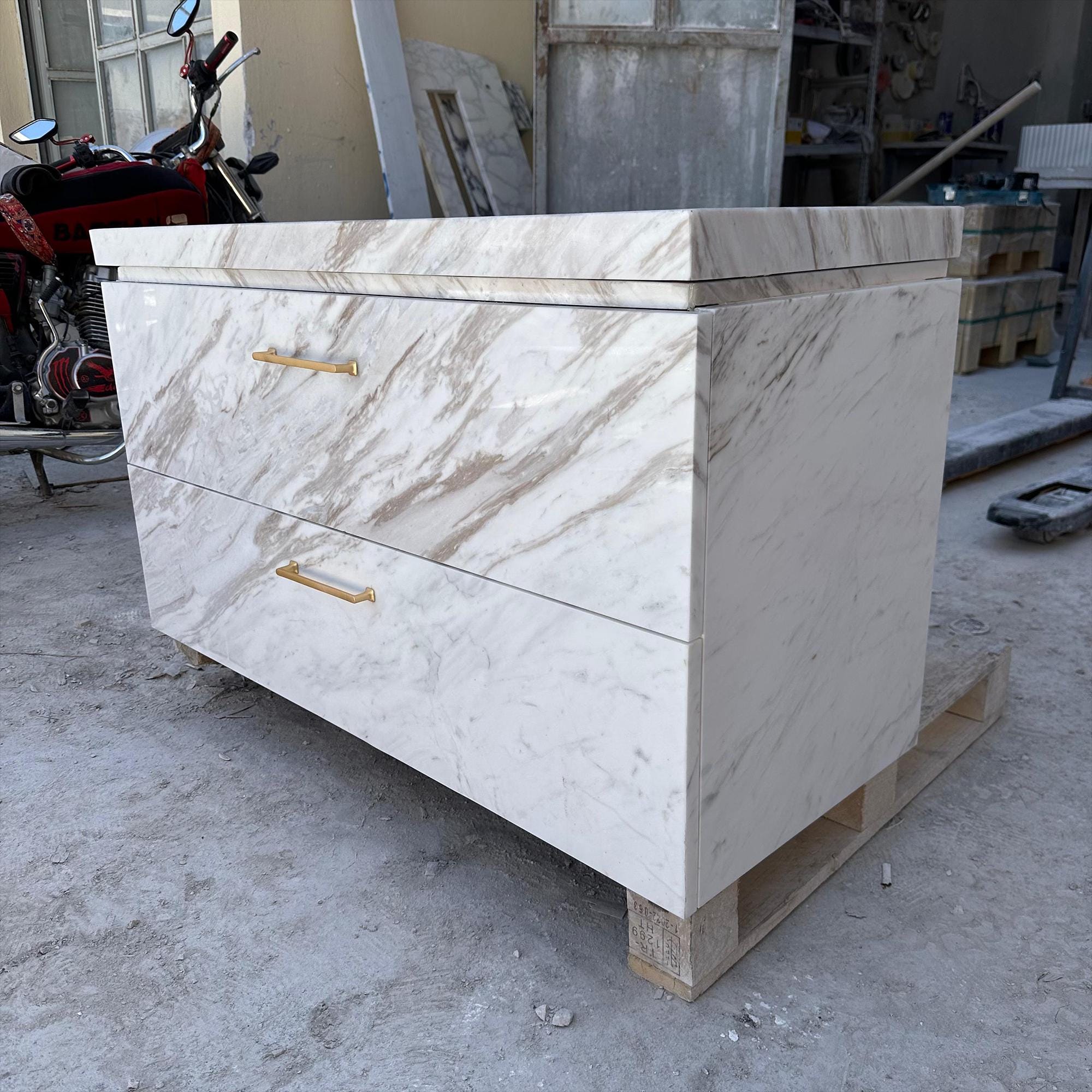 luxury marble vanity with gold drawer pulls