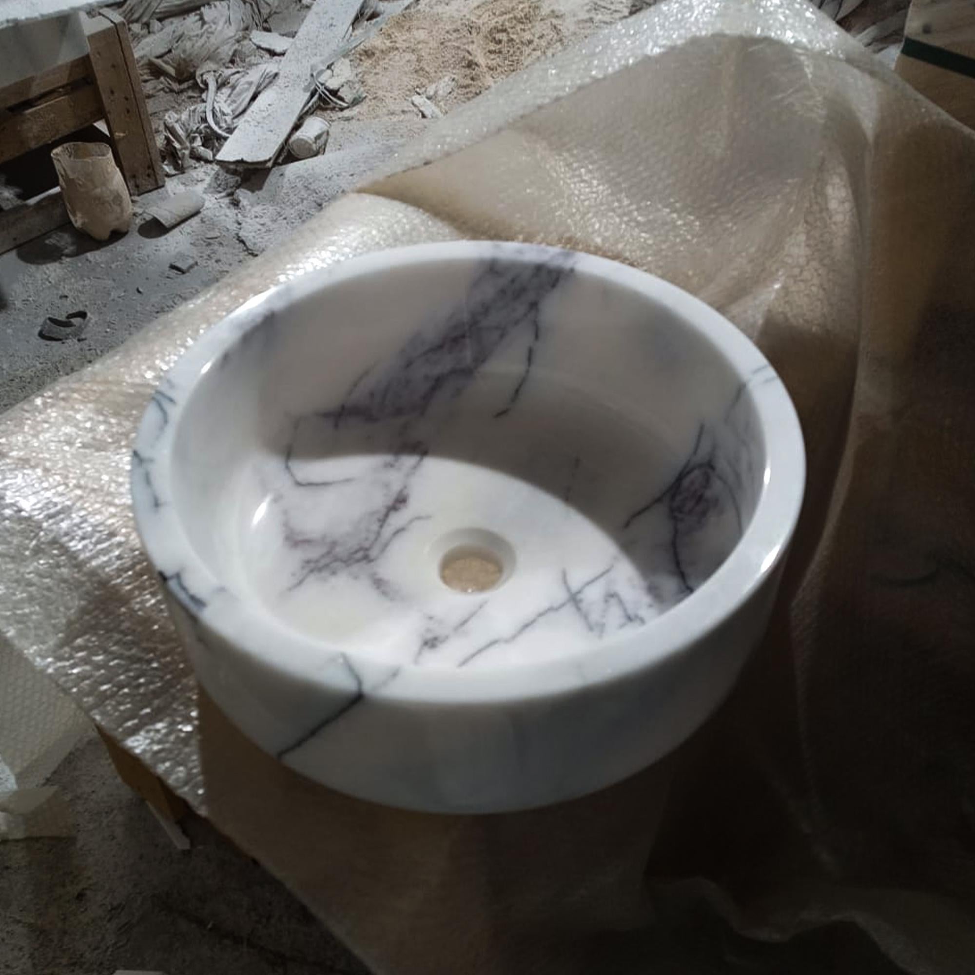 powder room vessel sink in carrara marble